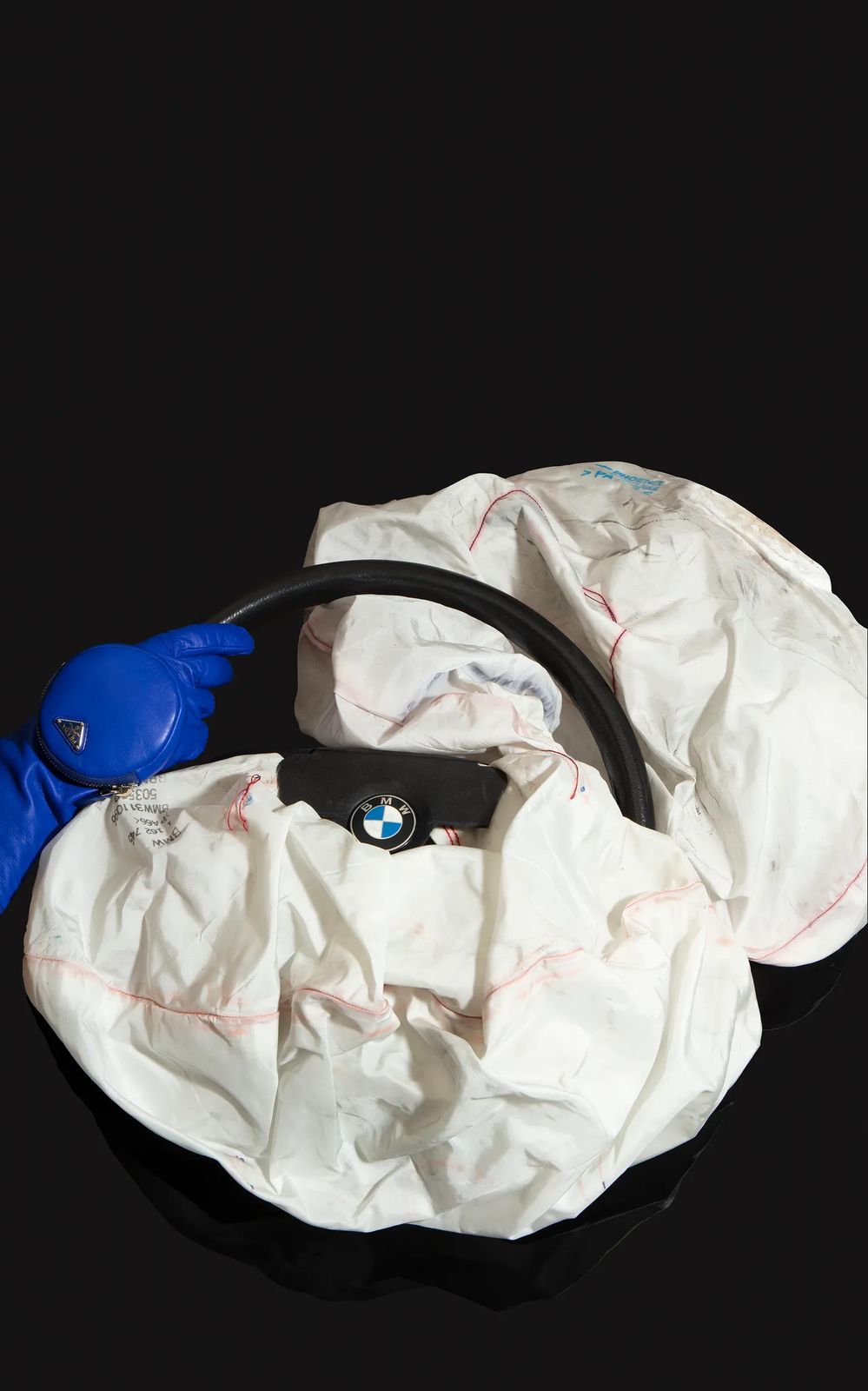 BMW airbag, Prada glove