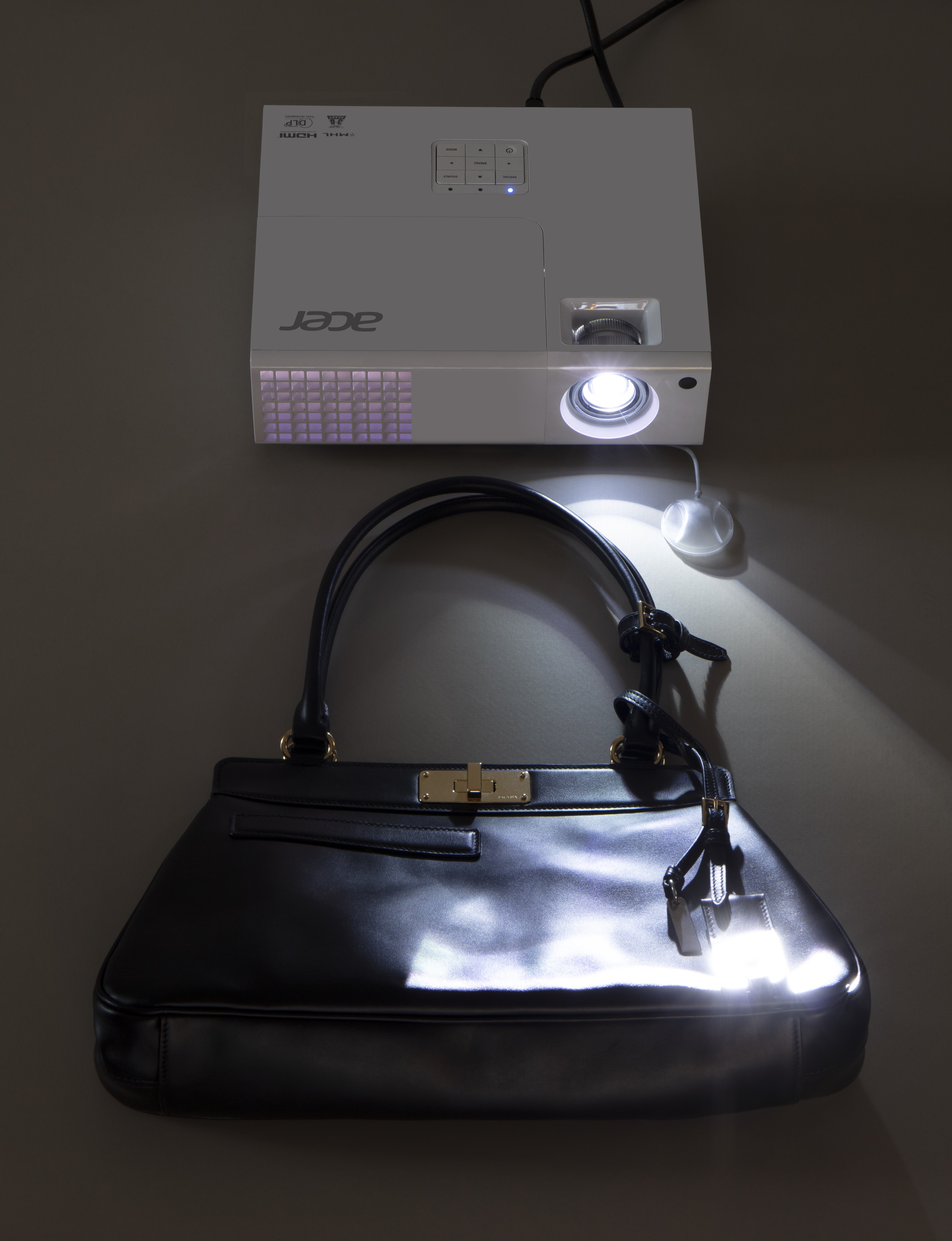 Prada handbag, projector spill